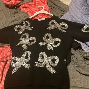 Cashmere wool black holiday sweater with sequins.